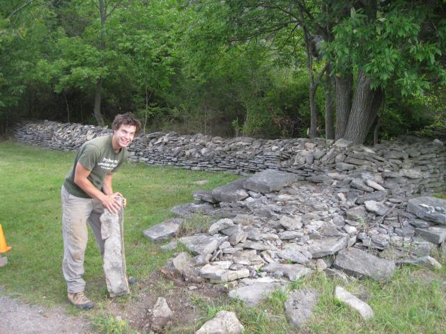 The DSWAC's  I R consultant Evan Oxland inspects the remains of a Ferris Park wall